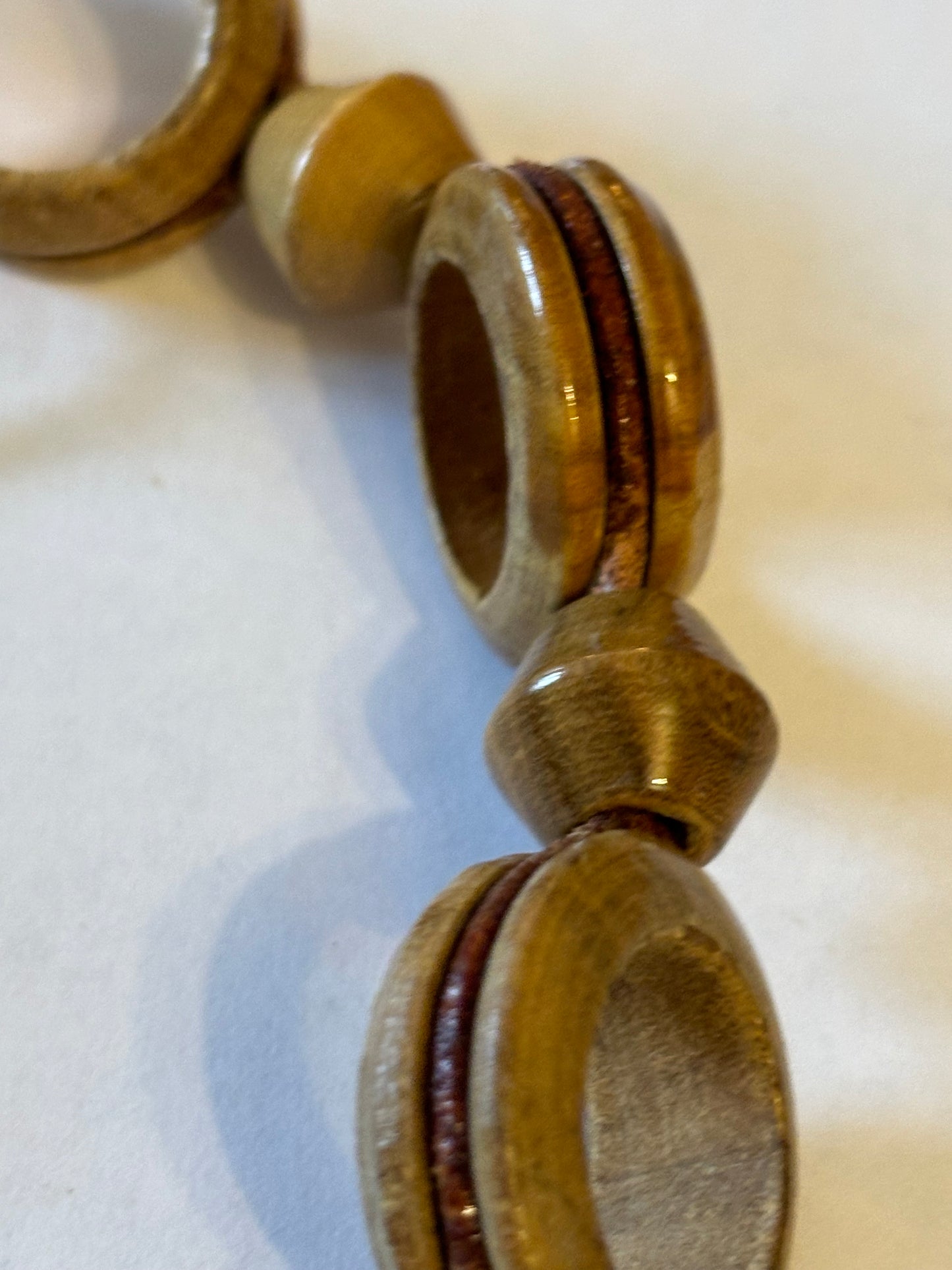 Very long glossy wooden rings and bead necklace