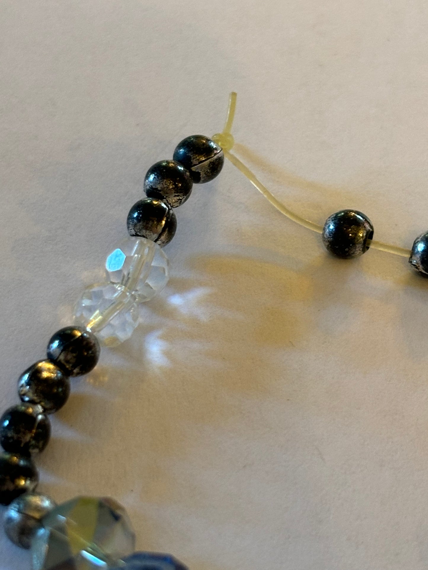 Silver, clear blue and gold beaded bracelet