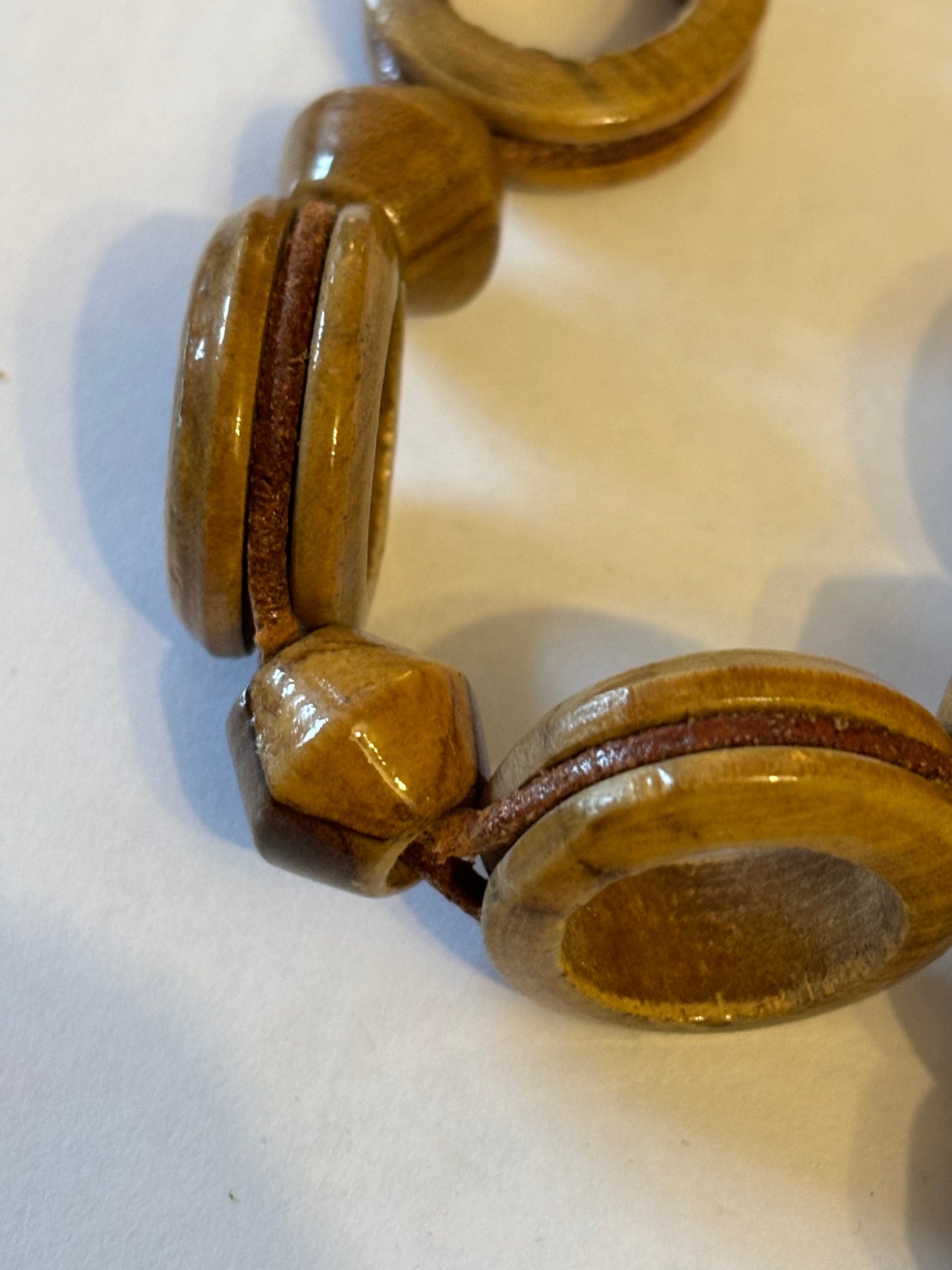 Very long glossy wooden rings and bead necklace