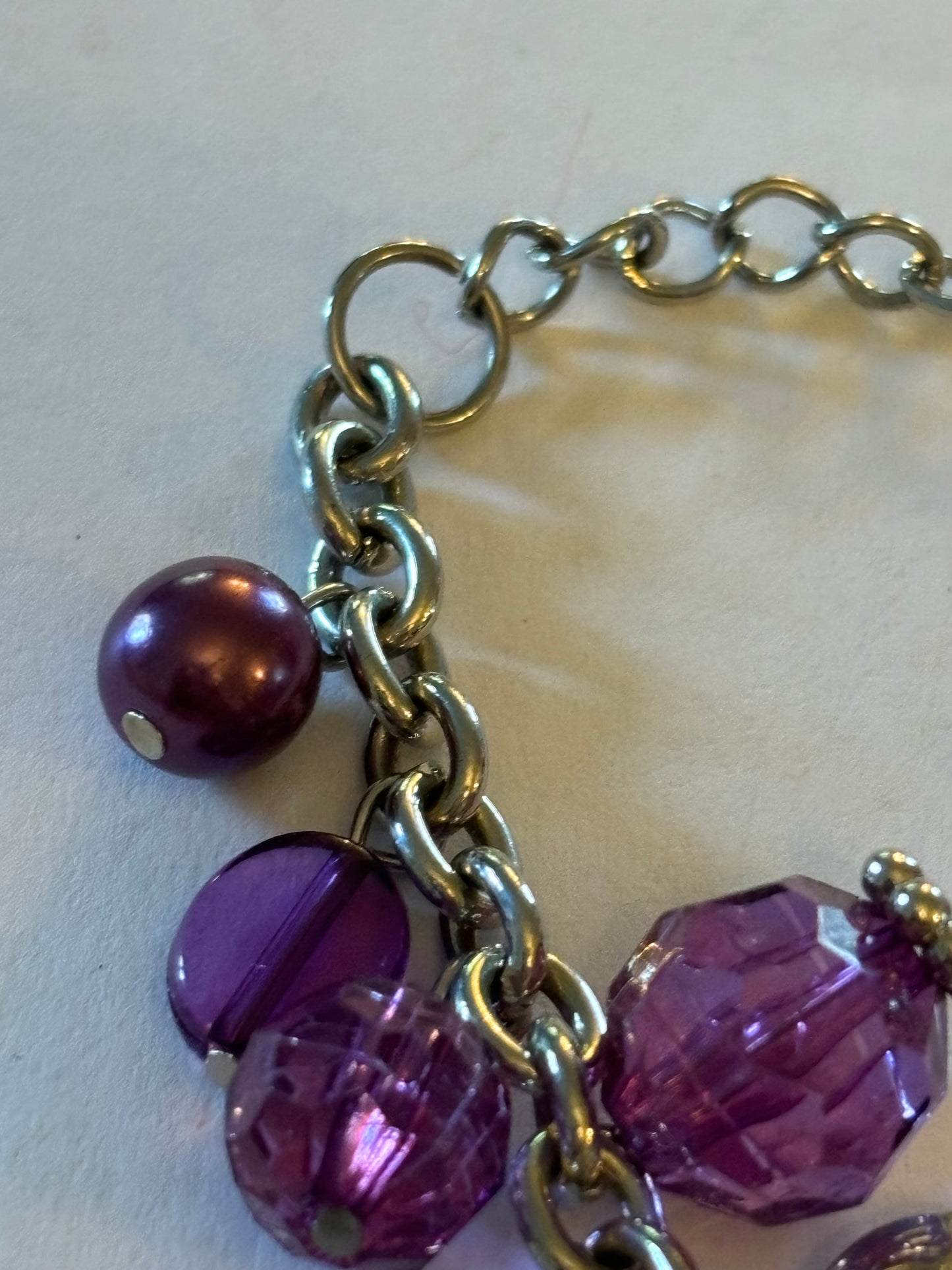 Purple and silver beads and hearts bracelet