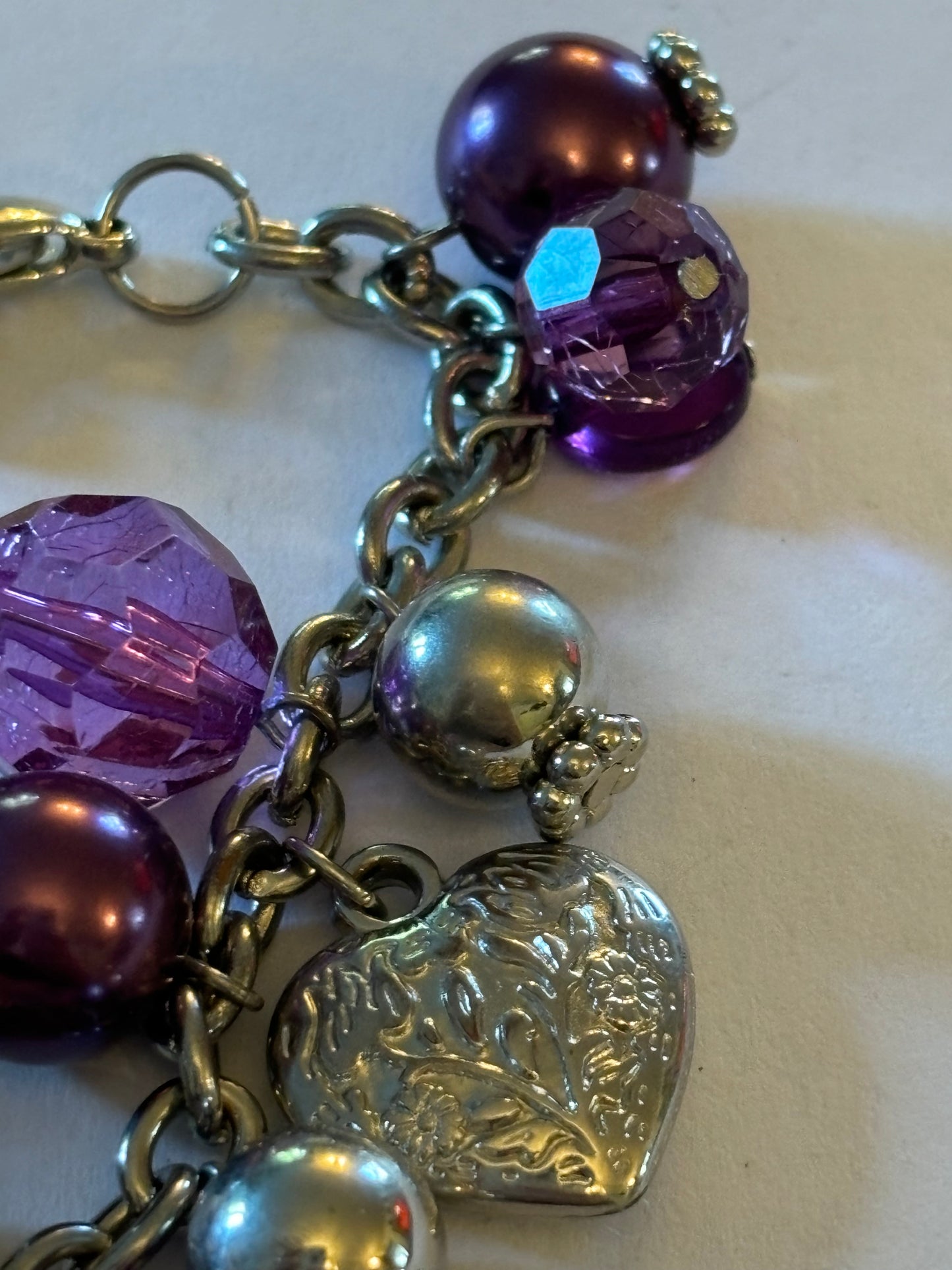 Purple and silver beads and hearts bracelet