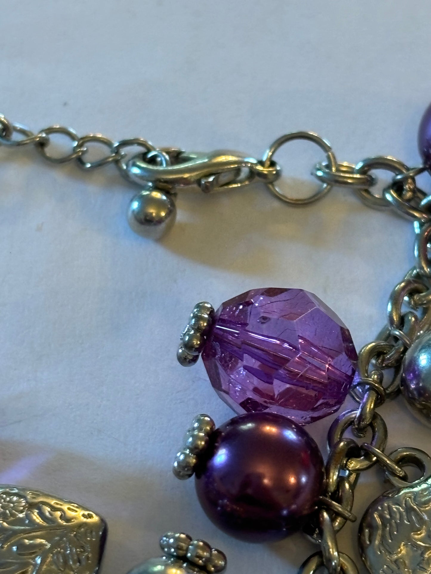 Purple and silver beads and hearts bracelet