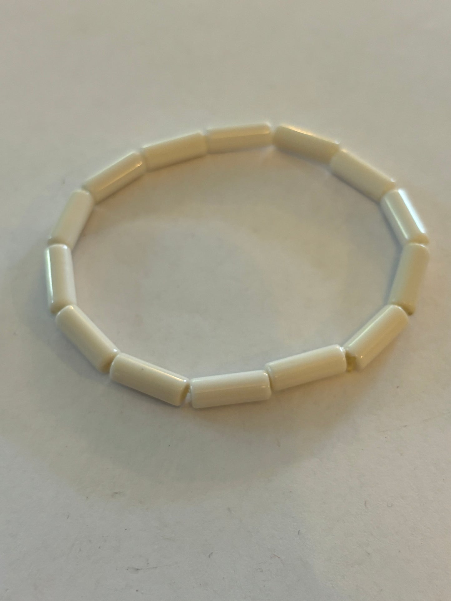 Simple bright white tube bead stretch bracelet