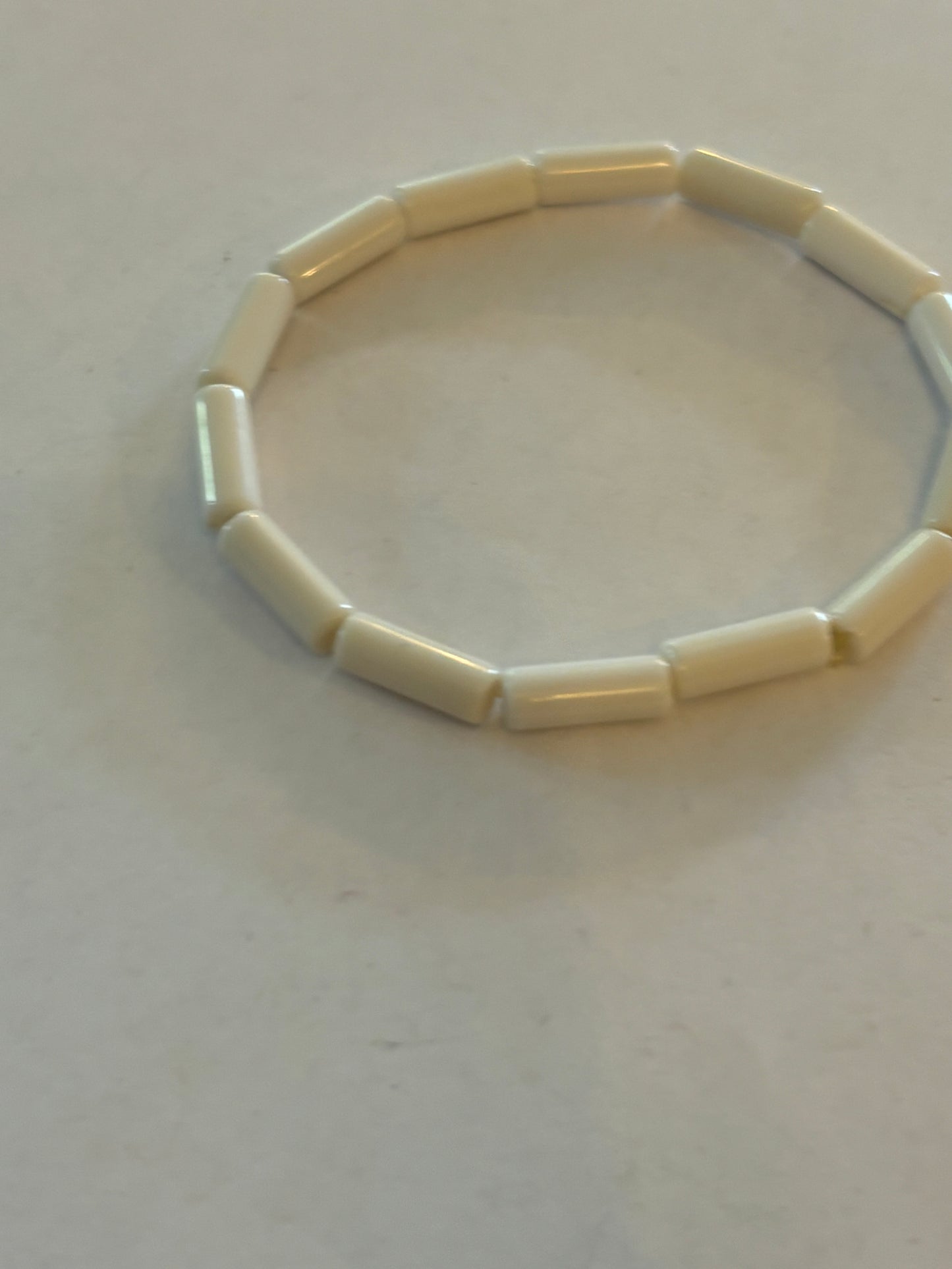 Simple bright white tube bead stretch bracelet