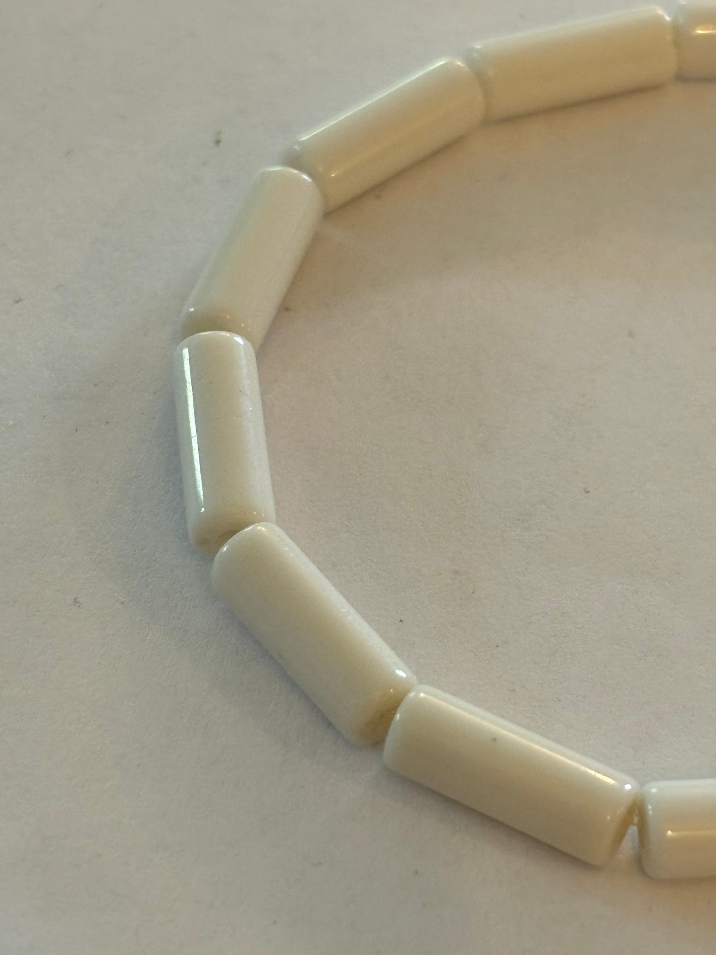 Simple bright white tube bead stretch bracelet