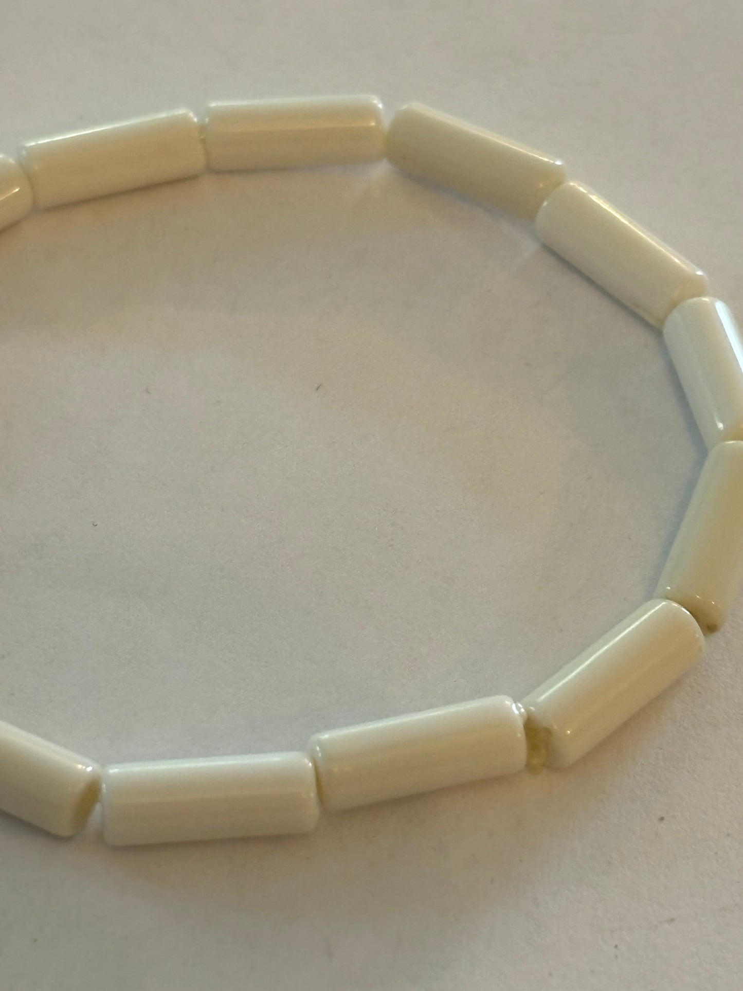 Simple bright white tube bead stretch bracelet