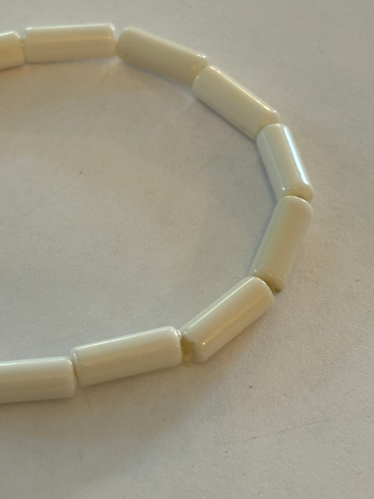 Simple bright white tube bead stretch bracelet