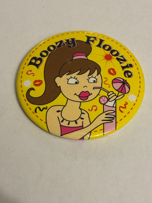 Boozy Floozie - Yellow round tin badge