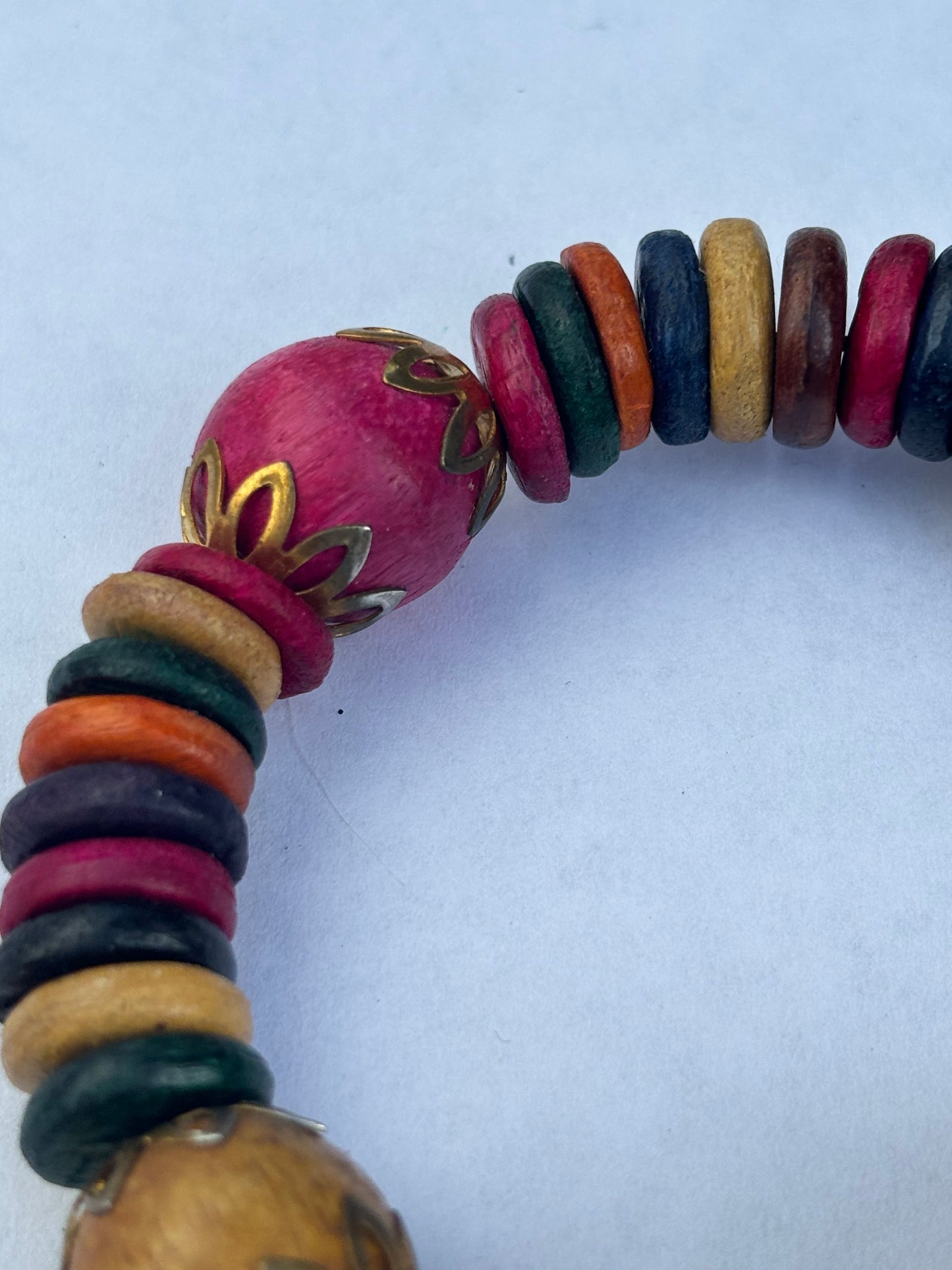 Coloured wooden disc wrap bracelet with jingle bells