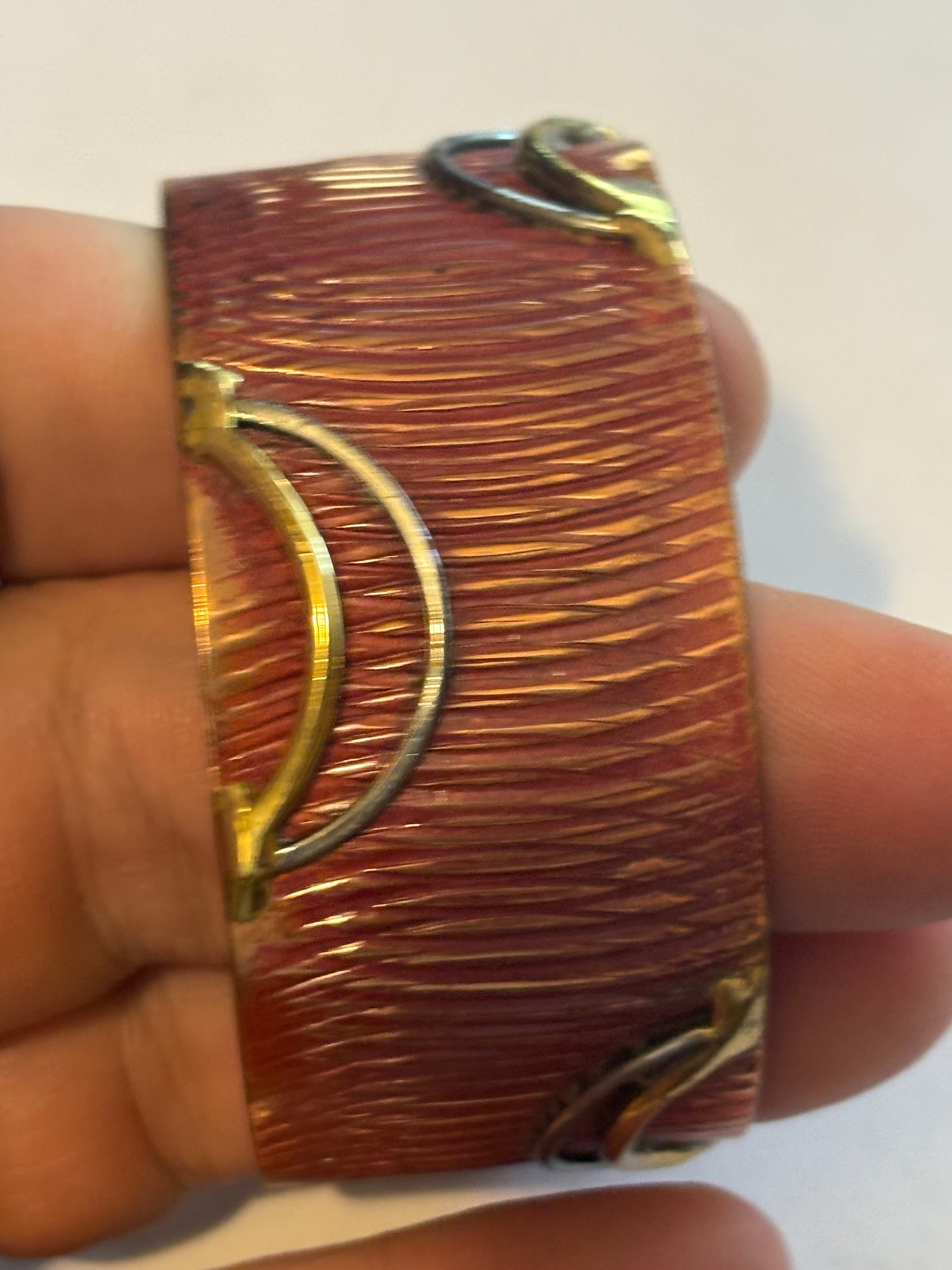 Copper coloured ridged bangle with gold decoration