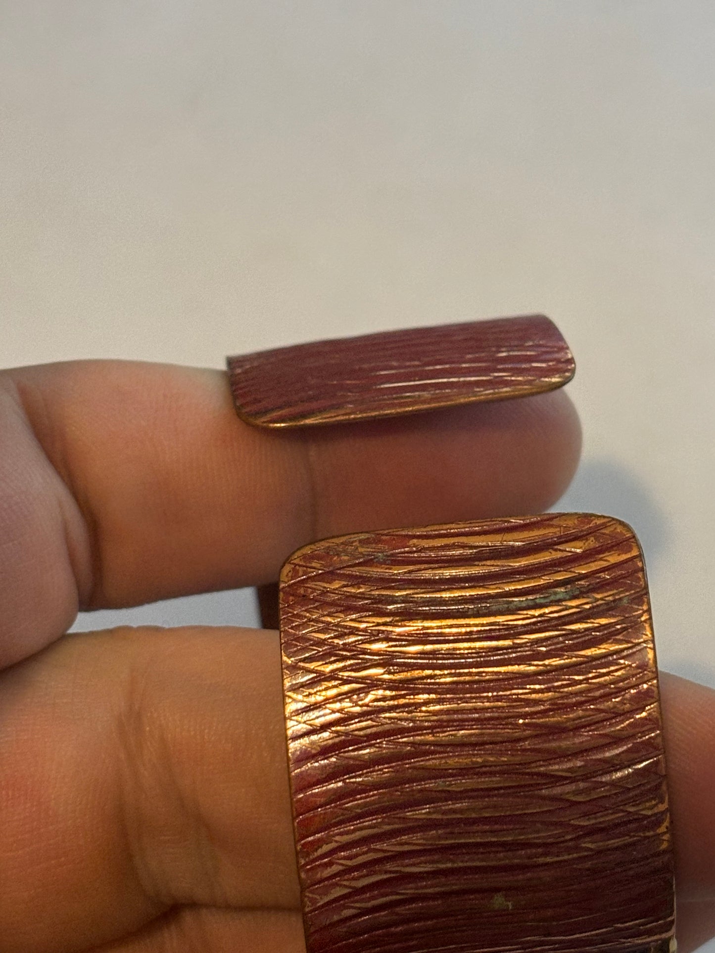 Copper coloured ridged bangle with gold decoration