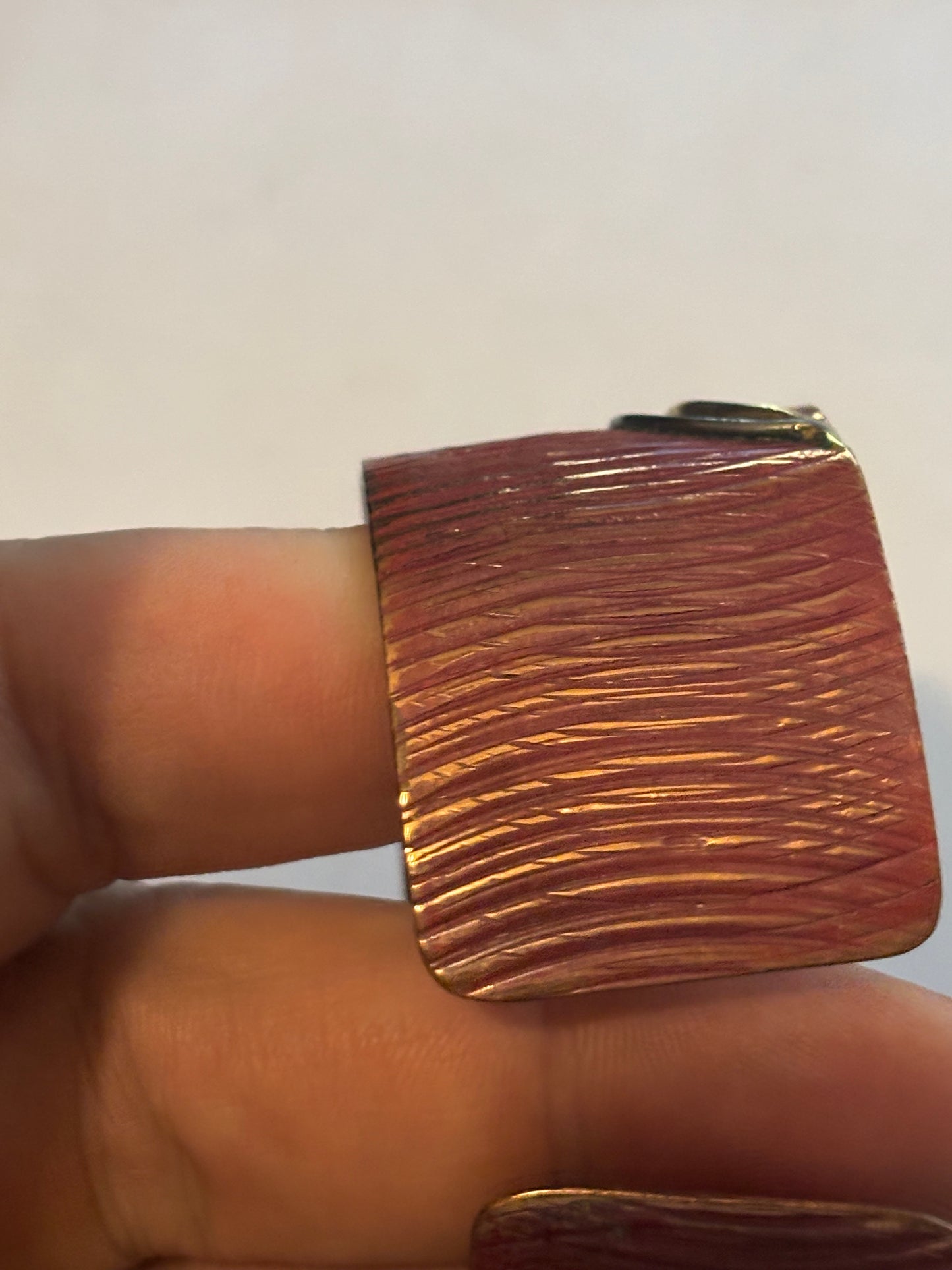 Copper coloured ridged bangle with gold decoration