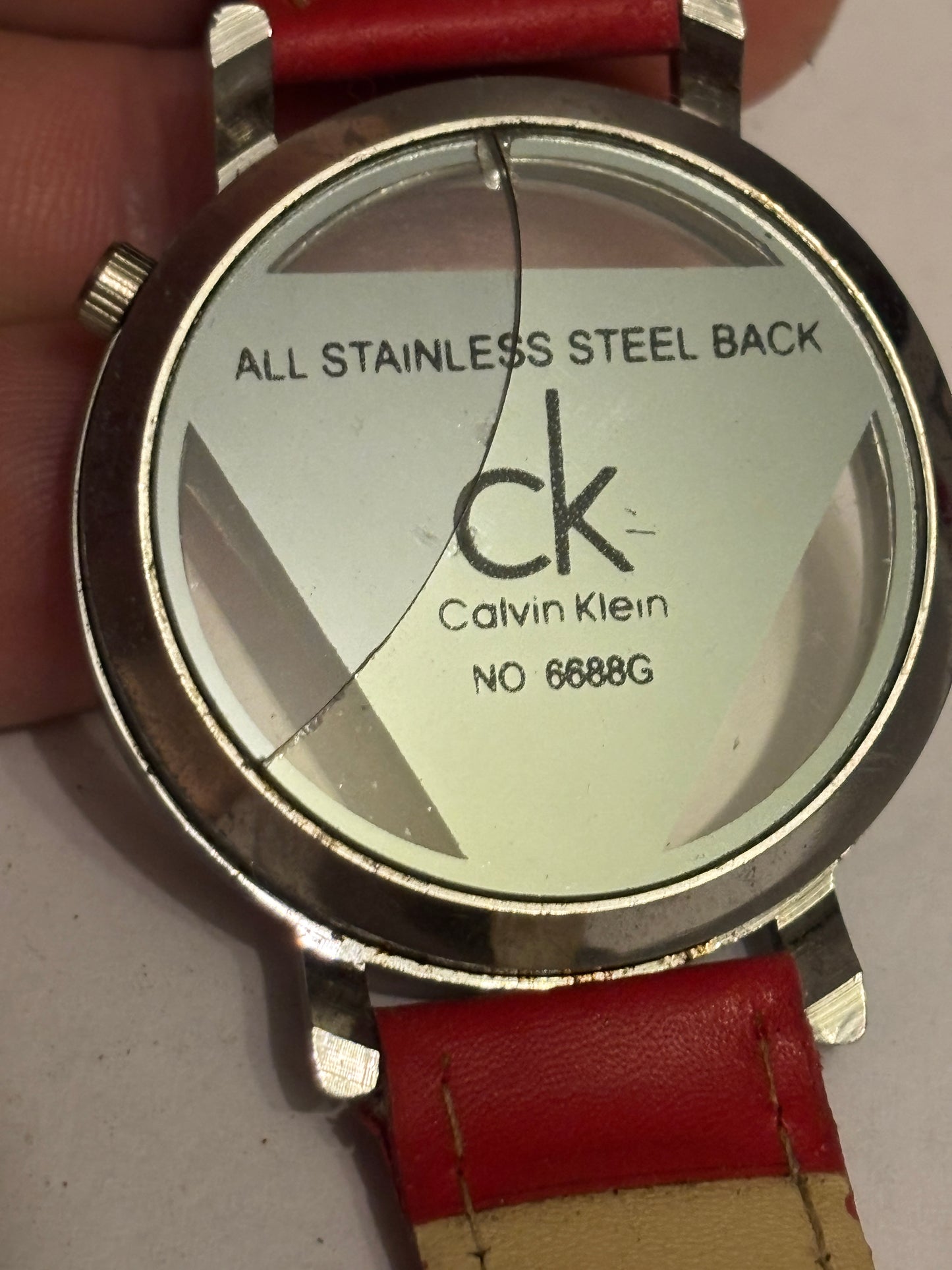 Calvin Klein - Ladies red and silver glass watch - Untested